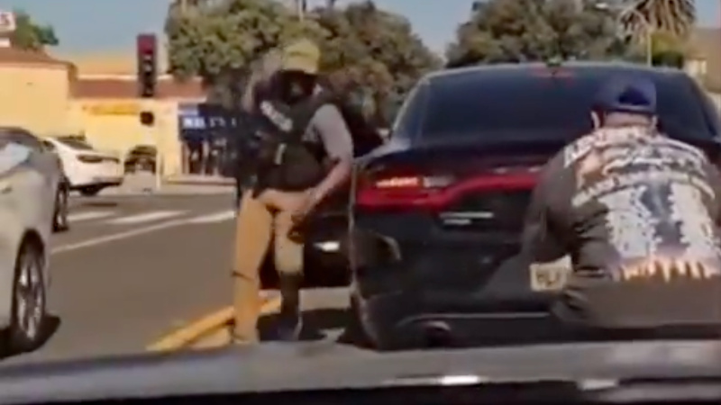Watch: Federal Officer Draws Weapon on Man Crouched Behind His Car at Stoplight in California